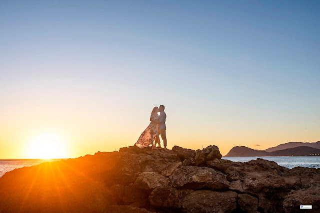 Sunset engagement photography on rocks in Oahu. 
