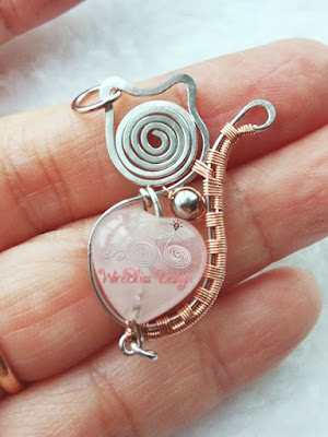 Wire wrapped cat pendant with rose quartz and stainless steel metal bead