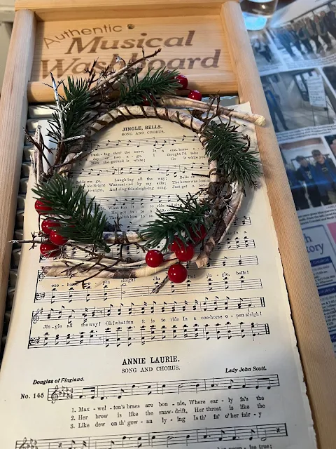 Photo of a washboard being decorated for Christmas.