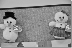 Mr. and Mrs. Snowman brighten up a bulletin board in the Business Office.