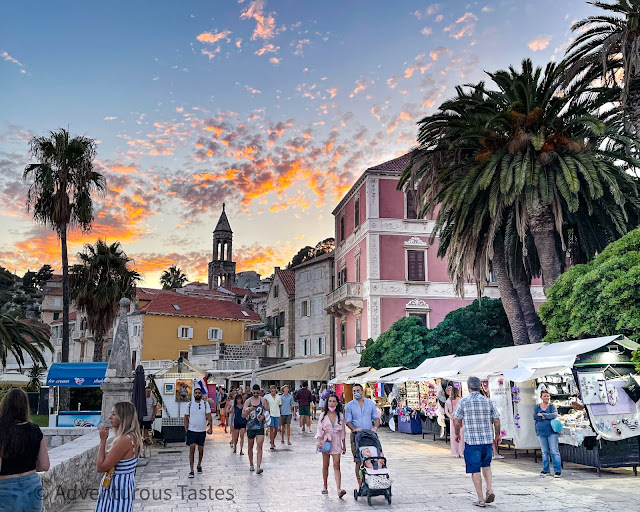 Sunset and people strolling in Croatian island village