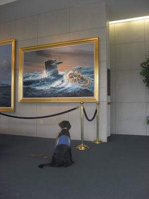 Picture of Rudy looking at a painting on the wall 