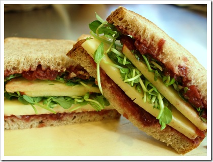 sandwich, adirondack cheddar, migliorelli honeycrisp apple, beth's farm cranberry horseradish chutney, little seed garden pea shoots