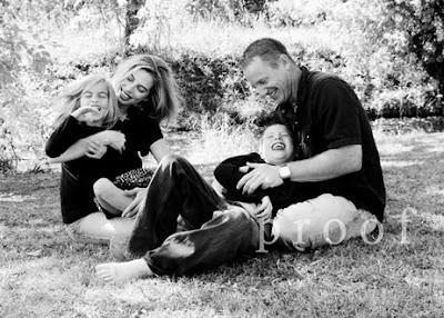 Keller Texas family portratit photography photo of fun family tickle session outdoors in park