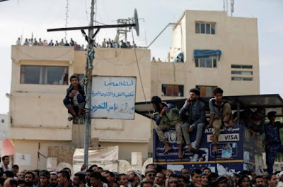 Crowd watching a public execution in Yemen