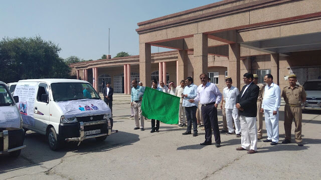 District Magistrate Mr. N P Singh flagging off the vehicles