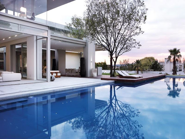 Large swimming pool in front of Modern Luxury House In Johannesburg