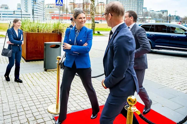 Crown Princess Victoria wore a Miller bluebell double breasted dickey jacket by Veronica Beard, and vertical striped bow blouse by Gant