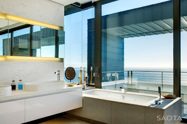 Picture of modern furniture by the window in the bathroom with the ocean view
