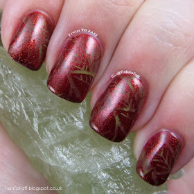 Fall or Autumn leaves nail art with marbled stamping over a glittery base.