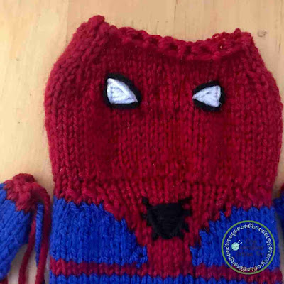 Picture of close up of knitted spidermans head unstitched