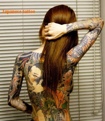 This light coloured full upper arm tattoo is very Japanese and symblises