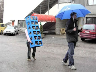 Woman Carrying beer with man holding umbrella