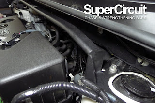 Close-up on the LH SUPERCIRCUIT Front Strut Bar brackets on the Toyota Harrier XU60 front strut mount.