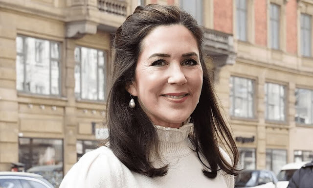 Crown Princess Mary wore an essential wool sweater by CO, and pleated printed silk crepe de chine midi skirt by Valentino