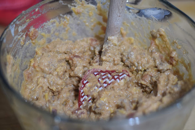 All the ingredients for the spicy sausage and bean dip mixed together in the bowl.