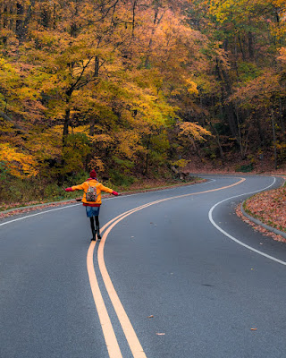 A woman walking down a road