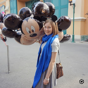 awayfromblue Instagram | mickey mouse balloons outfit pic disneyland studios Paris grey skater dress cobalt scarf