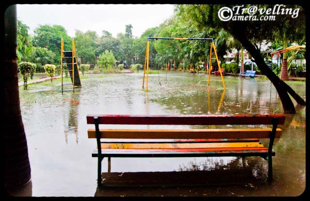 Noida parks flooded with water after rains 2010 - Sector-26 : Monsoon Effect in Noida : Posted by VJ SHARMA at www.travellingcamera.com : This weekend I had to go for a Photo-Walk at Old Fort in Delhi but due to heavy rains I canceled that program and woke up at 11:30 am on Sunday... After that I came out and noticed that many areas in my sector were flooded with water and the park near my house was completely filled with rain water in it.. Here are few photographs of the Sector-26 park after rains on Sunday...Here was the first few I saw in the morning... and then want back to my room to have Camera for capturing these moments :-)One part of Sector-26 park in Noida... where everything is flooded in water and one can walk on the concrete pathways on all four sides...I have seen worst condition of Noida after rains this year... I have been staying here for last 5 years and never seen this kind of after-effects of rains... Noida which is short for the New Okhla Industrial Development Authority, is an area under the management of the New Okhla  Industrial Development Authority... Noida has first-class amenities and is considered to be one of the more modern cities of Uttar Pradesh State of India. It is also home to the Noida Film City...Arre bhai kahan jaoon.. har jagah Paani hi Paani...Fresh green leaves after rains...When it rains, look up rather than down. Without the rain, there would be no rainbow...Noida is a major hub for multinational firms outsourcing IT services... Many large Software and Business Process Outsourcing (BPO) companies have their offices in the city...Generally noida is green and well planned as compared to other cities in UP.... although many of outsiders don't find it a good city to live...Here is the bench where we used to spend lot of time after dinner... Many times plan for morning walks but finally stick to this bench....Rains, Rains go away... please...some reflections inside the water... Hope it gets dry in short time...Reflection of colorful benches in Sector-26 Park in Noida...Water, Water... Everywhere water... no place to sit and no place to play around...Can we store this water somewhere? Many times I see folks in Sector-26 who waste lot of water for washing their multiple cars in summers when some of the areas in Noida doesn't get enough water for their routine activities... but now rains have already washed their cars :-)Its sad that children were not able to enjoy/play outside due to these heavy rains... Check out more about Noida @ http://en.wikipedia.org/wiki/Noida