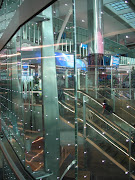 Dubai Airport. Dubai international terminal and OLED's in glass curtain wall .