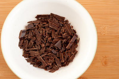 Chopped chocolate in a microwaveable bowl