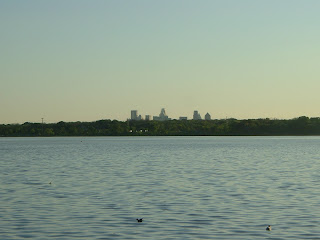 Downtown Dallas skyline seen in distance across White Rock Lake