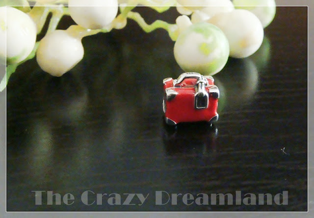 red travel suitcase charm