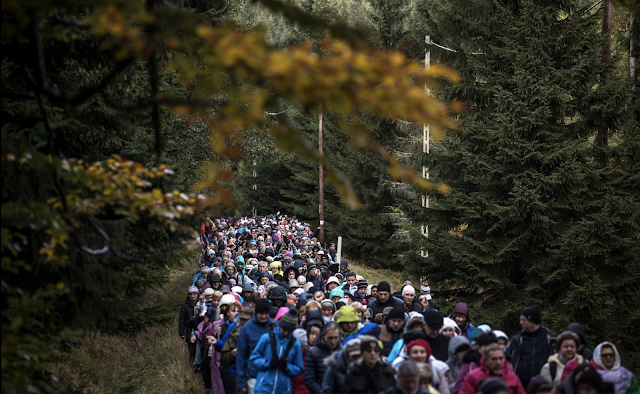 Poles in the forest on route to the Polish-Czech border to pray.