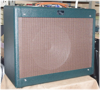 Green levant tolex and oxblood grill cloth cabinet