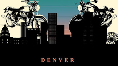 Denver skyline with Royal Enfield 650 twins behind it.