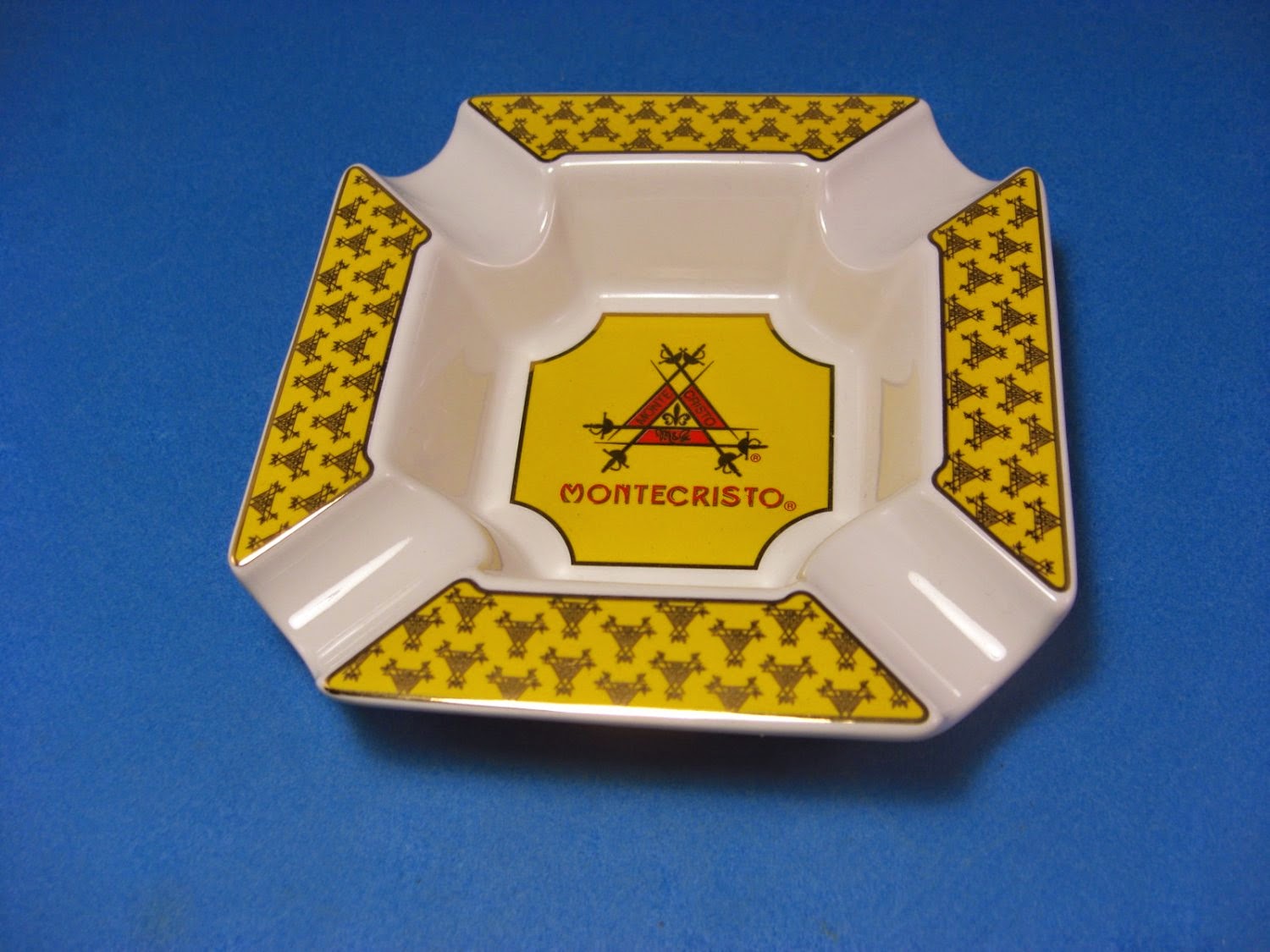 http://bargaincart.ecrater.com/p/22052065/montecristo-yellow-and-white-cigar-ashtray