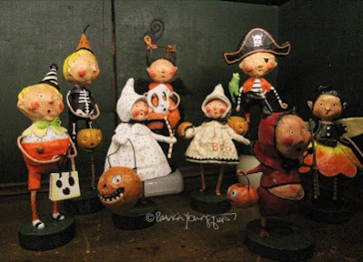 This photo features an array of whimsical figurines depicting  trick or treaters