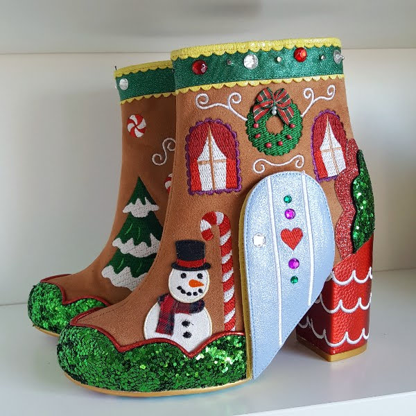 pair of Irregular Choice Christmas gingerbread themed ankle boots on white shelf