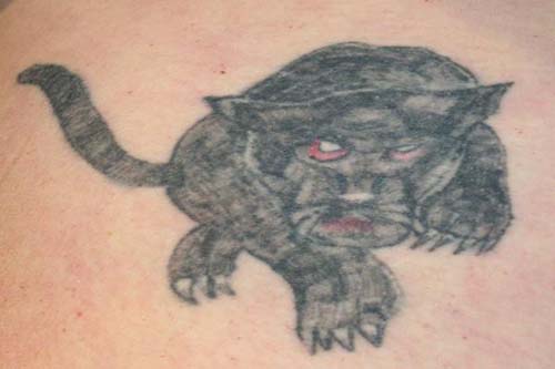 is just an ugly tattoo gone bad. Notice how out of center that thing is?