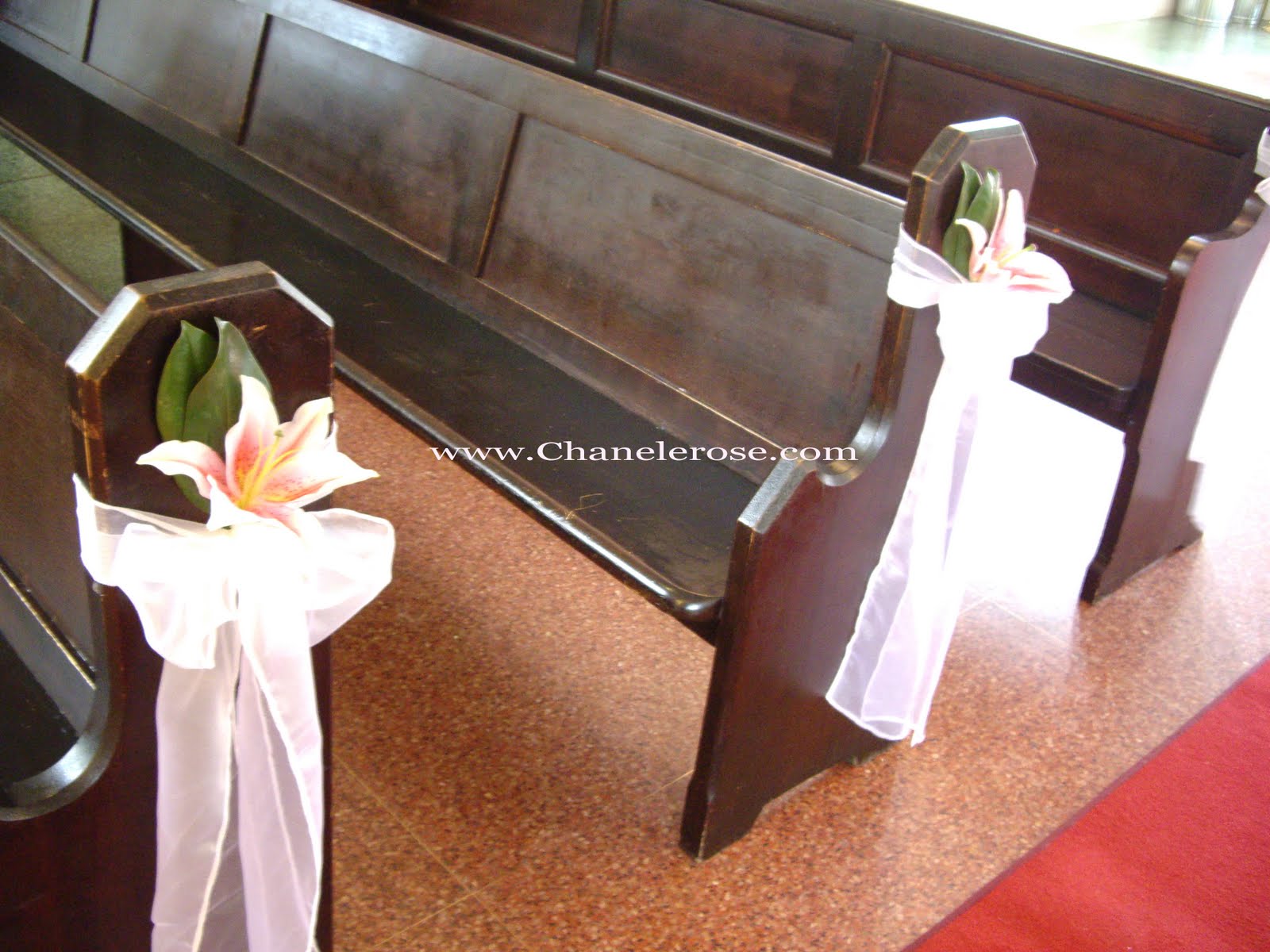 wedding flowers on church pews