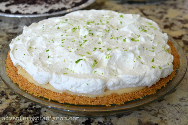 key lime pie with whipped cream topping and crust made from graham crumbs