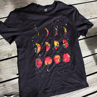 black t-shirt with red planet