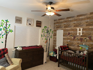nursery angle with ceiling fan facing window - cabin theme