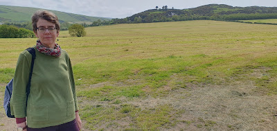 Colour photo showing author Ally Sherrick at the site of Knockaloe Internment Camp on the Isle of Man