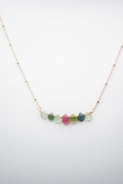 A natural stone rainbow adds delicate beauty. Image credit Raw Amor.