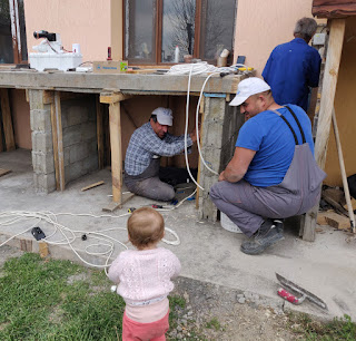 Bekir working while Rosie watches on