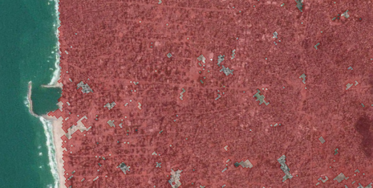 a close-up satelitte view of a Gaza neighborhood colored almost completely red