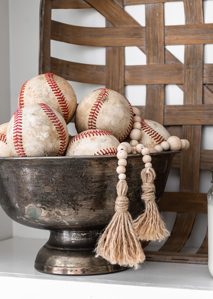 baseballs in tarnished urn