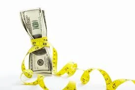 monetary policy “A currency note wrapped with a measuring tape, symbolizing the regulation of money supply, under the heading ‘Monetary Policy’.”