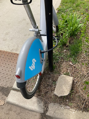 Divvy bike locked to sign post