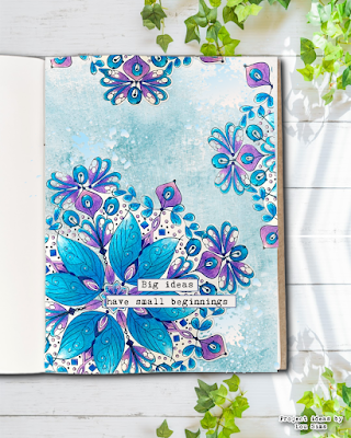 Art journal page with cut mandala pieces arranged on a soft watercolour background in coordinating colours."