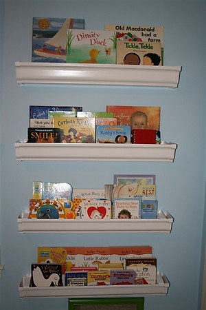 Rain Gutter Bookshelves students reading in front of rain gutter book shelves