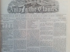 A newspaper with the header "Among the Clouds."