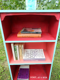 Coral and Red Painted on the Inside of a Bookcase from Denise on a Whim