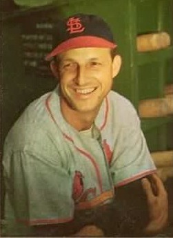 Stan Musial smiling in uniform for St. Louis